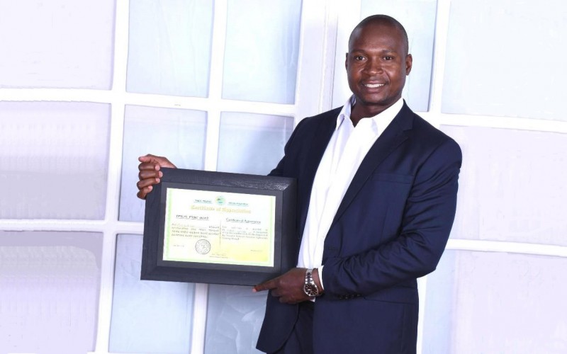 Dr. Robert Fungo, Lecturer-Department of Food Technology and Human Nutrition, CAES, Makerere University, Kampala Uganda poses with a Certificate of Appreciation from the Federal Government of Ethiopia received on 26th March 2019.
