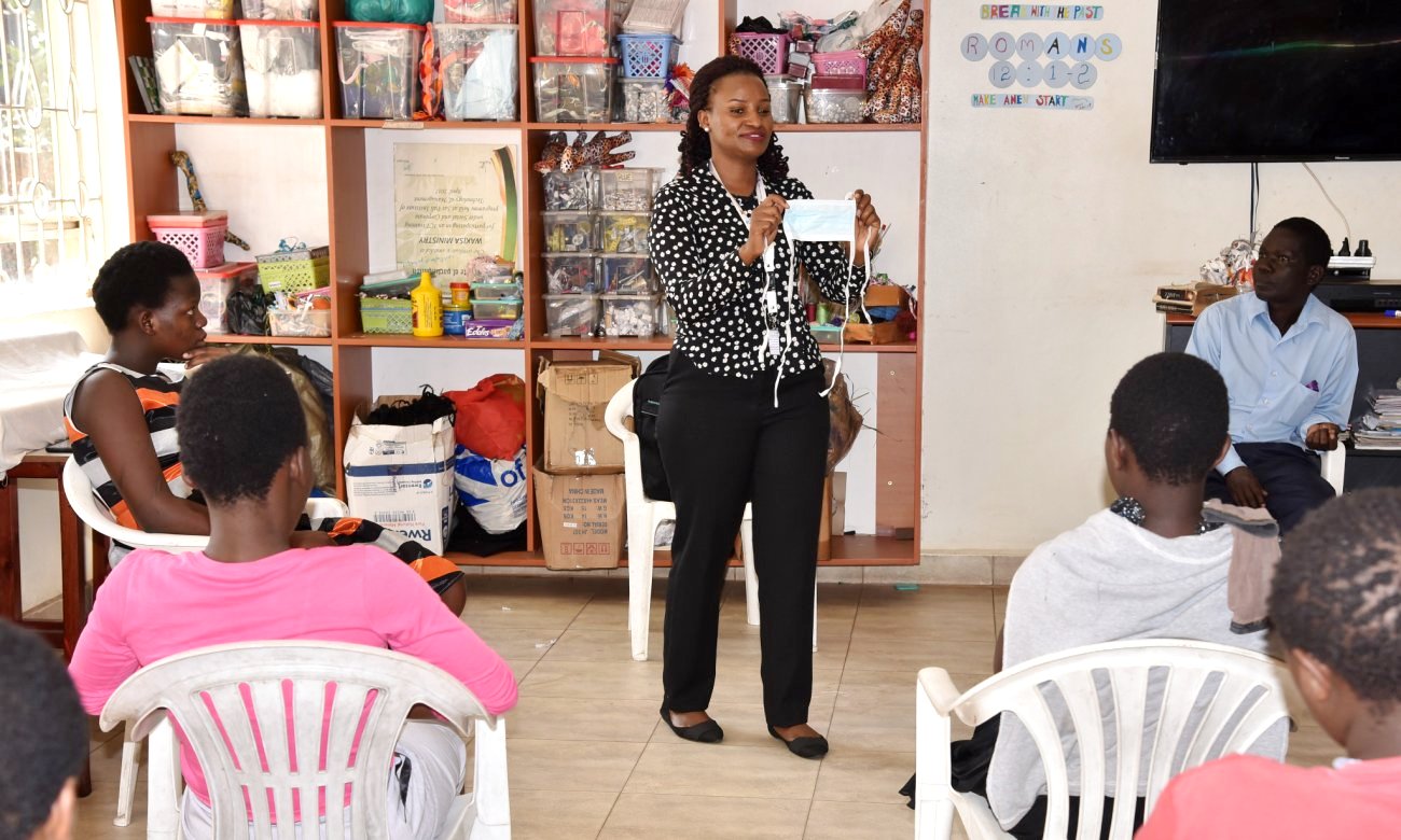 A Member of Staff from IDI delivers a talk on COVID-19 Infection Prevention Control staff and girls at the Wakisa Pregnancy Crisis Centre, Namirembe, Kampala Uganda.