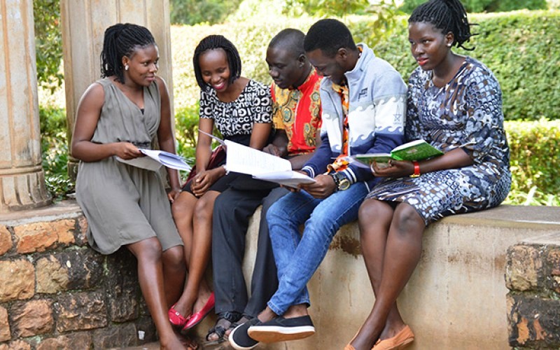 Students hold a group discussion in the Arts Quadrangle, College of Humanities and Social Sciences, Makerere University, Kampala Uganda. Date taken: 13th April 2018.