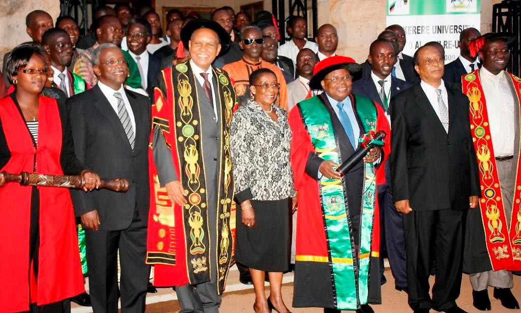 H.E. Dr. (h.c.) Benjamin William Mkapa (3rd R) and his wife Mrs. Anna Mkapa (C) pose with officials shortly after the conferment of the Honorary Doctorate of Laws of Makerere University, Kampala Uganda on 27th November 2009. Present were; Rt. Hon. Apolo Nsibambi (2nd R), Prof. Mondo Kagonyera (3rd L), Hon. Amama Mbabazi (2nd L), Prof. Venansius Baryamureeba (R) and other officials. The mace-bearer was Grace Ruto (L).