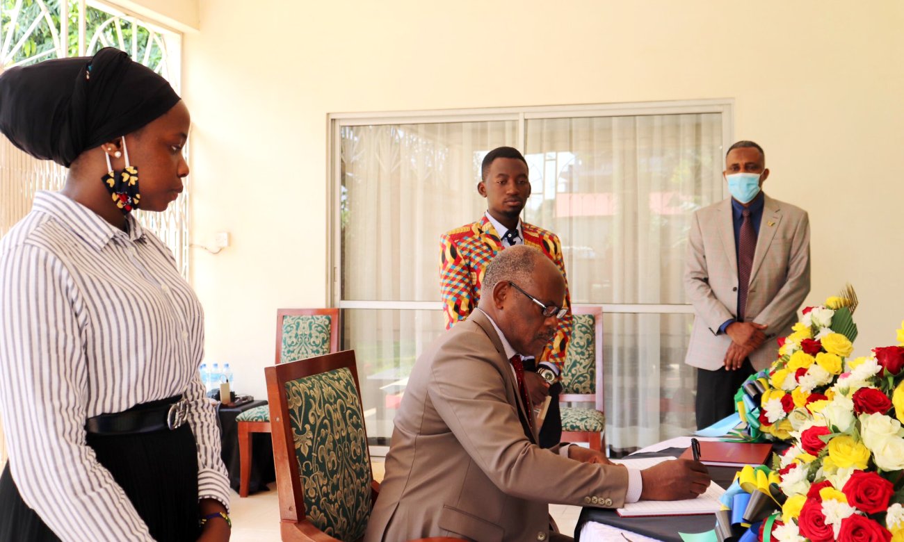 The Vice Chancellor-Prof. Barnabas Nawangwe signs the condolence book opened up in respect of the late H.E. Benjamin William Mkapa on 29th July 2020 at the High Commission of the United Republic of Tanzania, Kampala Uganda.