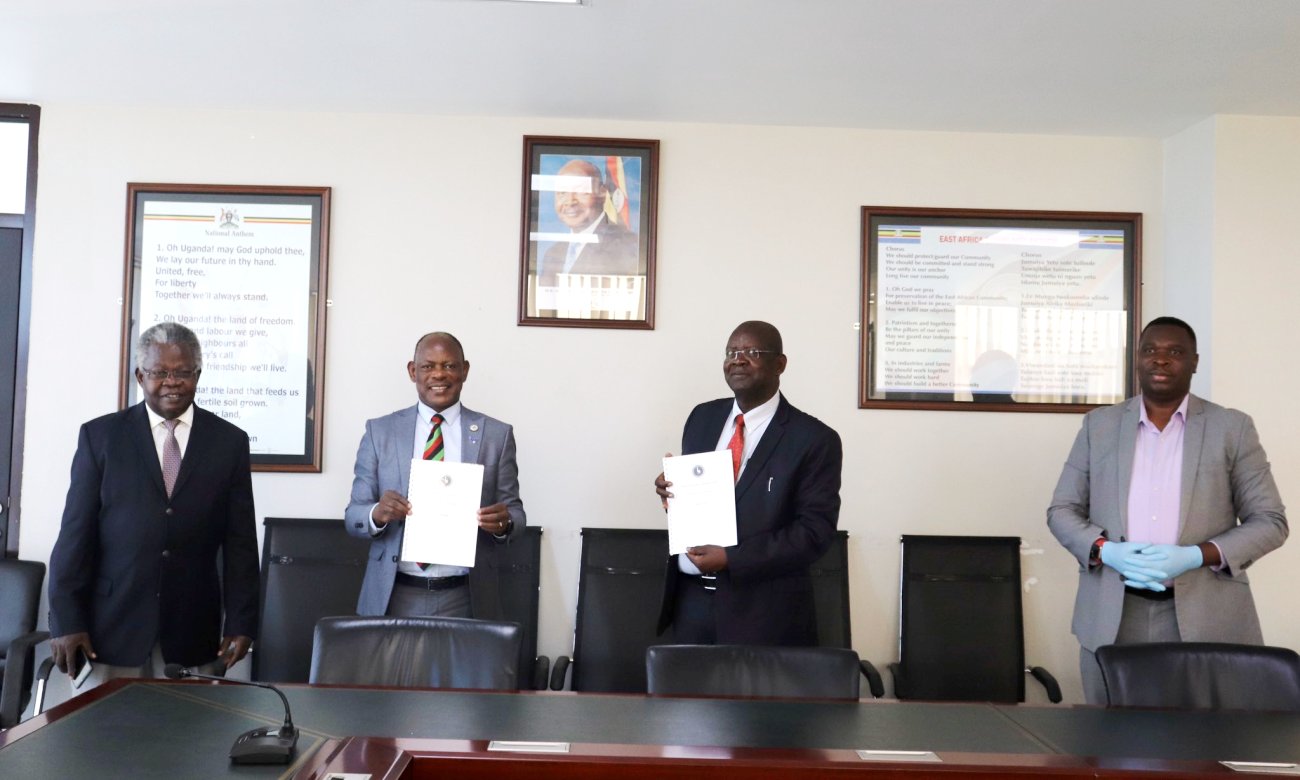 The Vice Chancellor-Prof. Barnabas Nawangwe (2nd L) and PS MoSTI-Mr. Obong David (2nd R) show off the signed Governance Charter as KMC's Executive Chairman-Prof. Sandy Stevens Tickodri-Togboa (L) and CEO-Mr. Paul Isaac Musasizi (R) witness on 24th March 2020, Kampala Uganda.