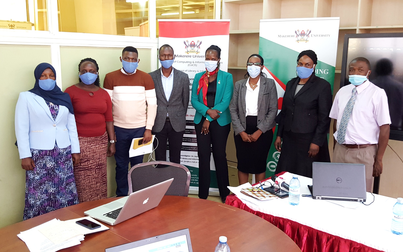 The Project PI-Dr. Joyce Bukirwa (2nd R) with R-L: Dr. David Luyombya, Ms. Carol Kamugira and Ms. Harriet Adong (Mak-RIF) and Researchers: Mr. Richard Batte, Mr. Aloysius Ssenono Mwanje, Ms. Lois Mutibwa and Ms. Faridah Muzaki after the research dissemination on 19th August 2020, EASLIS, CoCIS, Makerere University, Kampala Uganda.