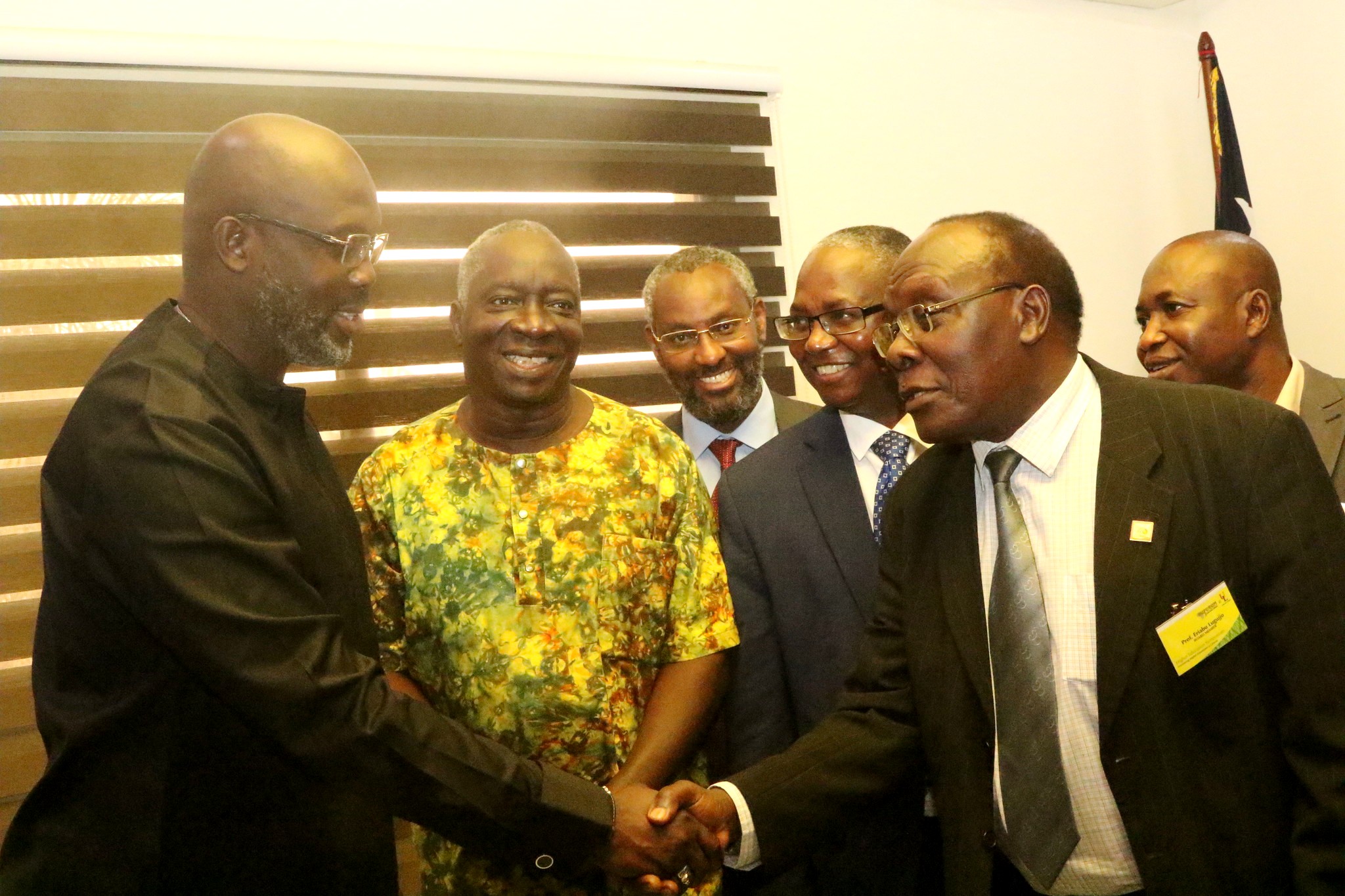 Liberian President, H.E. George Weah (Left) shakes hands with RUFORUM Board Member and Vice Chancellor Ndejje University-Prof. Eriabu Lugujjo (Right) as Executive Secretary-Prof. Adipala Ekwamu (2nd Left) and other members witness during the meeting in April 2019. The meeting followed the Liberia Higher Education Day held in Monrovia. Photo credit: RUFORUM