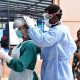 Staff from IDI and the Ministry of Health engage in Personal Protective Equipment demonstrations after a two-day progam to spearhead the rollout of COVID-19 Infection Prevention and Control (IPC) guidelines on 27th April 2020 at the IDI-McKinnell Knowledge Center, Makerere University, Kampala Uganda.