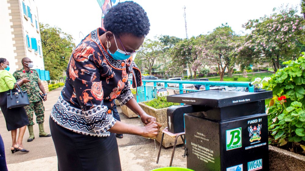 The Minister of Health-Hon. Dr. Jane Ruth Aceng washes her hands after the launch on 16th September 2020 using the Touchless Handwashing Kit (TW-20) developed with support from the Government of Uganda through Mak-RIF