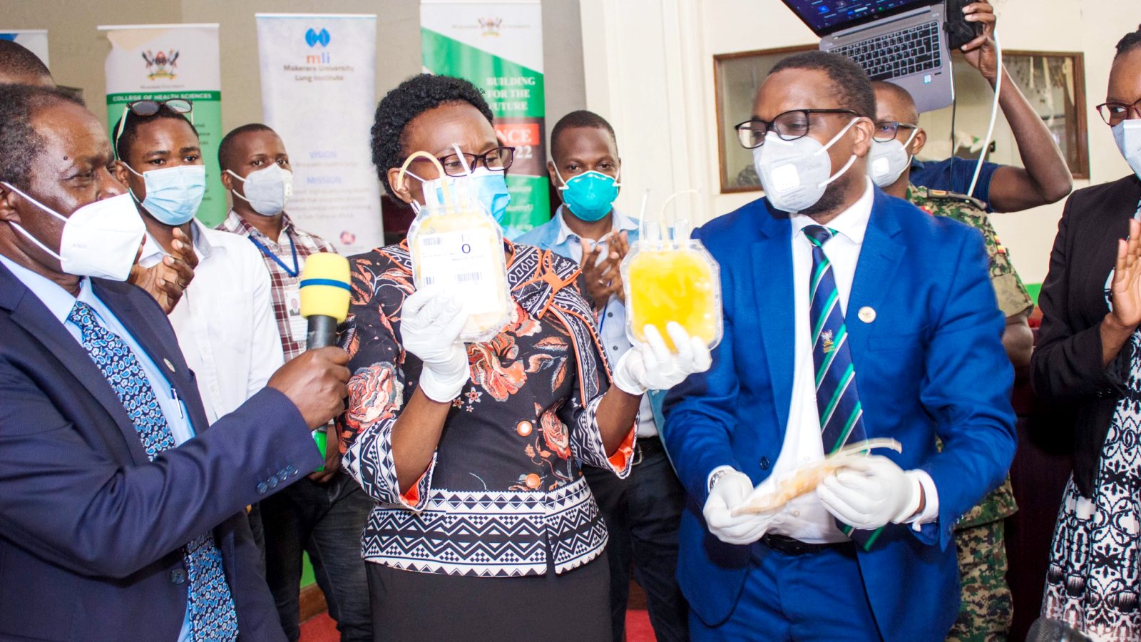 The Minister of Health-Hon. Dr. Jane Ruth Aceng (Centre) flanked by Chairperson Mak-RIF Grants Management Committee (Left), COVIDIT Principal Investigator-Dr. Bruce Kirenga (Right) and other officials from MLI, UPDF, UBTS, JCRC launches the COVID-19 Convalescent Plasma (CCP) Investigational New Drug on 16th September 2020, Main Hall, Makerere University, Kampala Uganda.