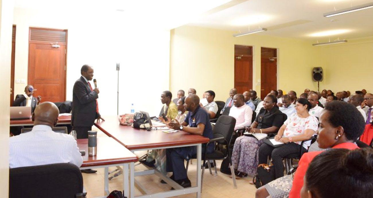 The Chairperson Mak-RIF Grants Management Committee-Prof. William Bazeyo (standing) addresses some of the Awardees at an earlier round. 160 addtional awards have been issued under Mak-RIF 2, Track 1.