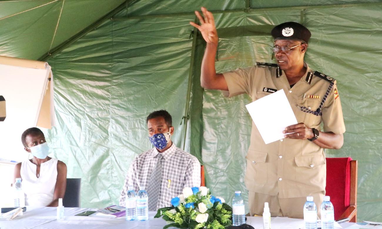 The UPF Director in charge of Operations-AIGP Edward Ochom (Right) makes his remarks as MakSPH officials-Mr. Abdullah Ali Halage (Centre) and Dr. Olive Kobusingye (Left) listen during the handover of 90 Lifebuoys at the Marine Base Headquarters, Kigo, Wakiso Uganda on 7th October 2020.