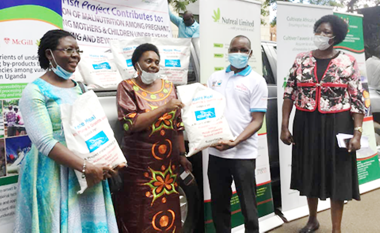 Hon. Mary Karooro Okurut (2nd L) receives the NutriFish Project donation from the Principal Investigator-Dr. Jackson Efitre (2nd R) as Assoc. Professor Dorothy Nakimbugwe (L) and Mrs. Joyce Ikwaput Nyeko (R) witness on 4th May 2020.