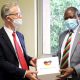 The Vice Chancellor-Prof. Barnabas Nawangwe (Right) receives a souvenir marking the 30th anniversary of the events leading to the fall of the Berlin Wall form German Ambassador to Uganda. H.E. Matthias Schauer (Left) during the courtesy call on 7th October 2020, CTF1, Makerere University, Kampala Uganda.