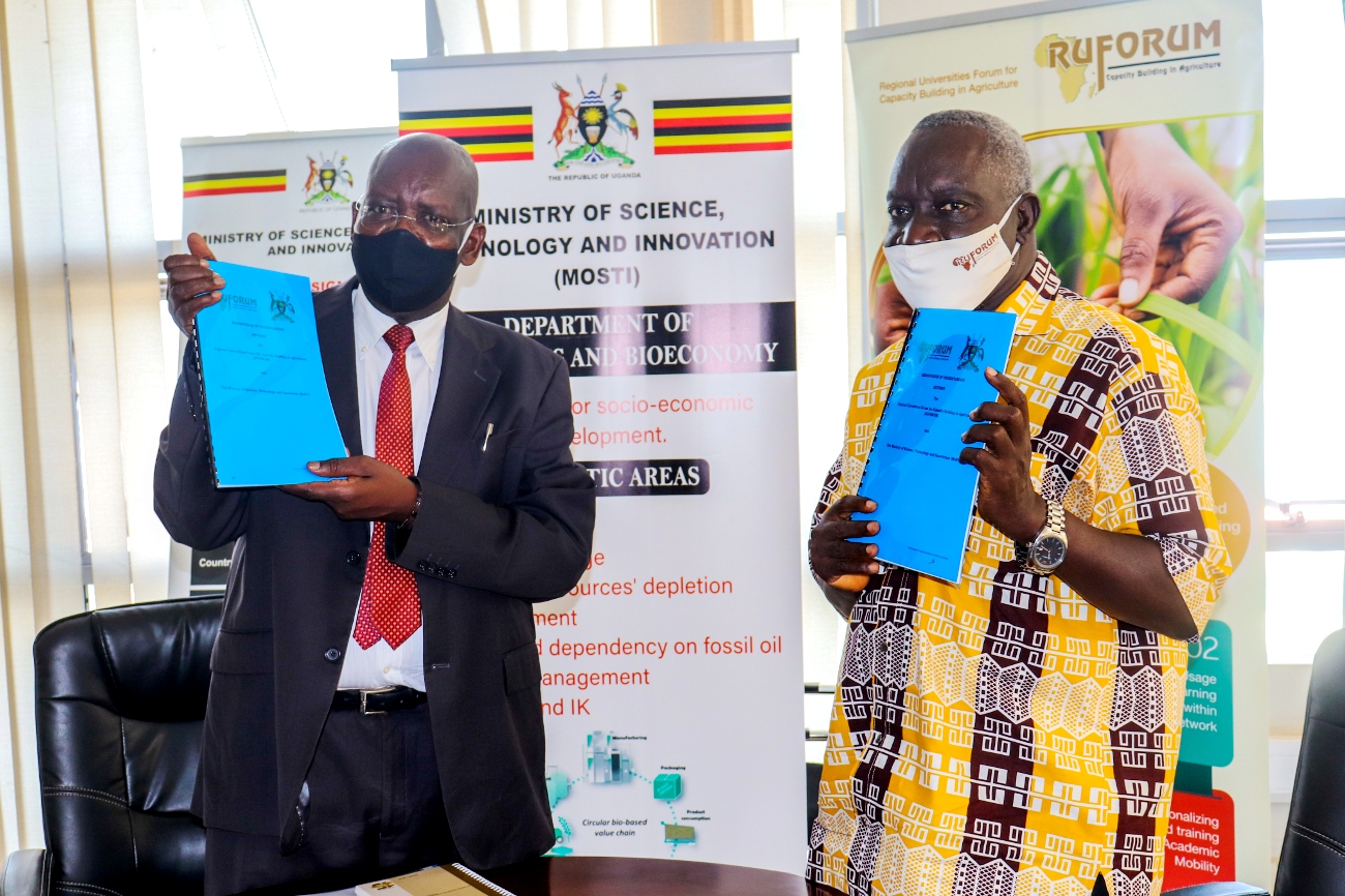 The Permanent Secretary MoSTI-Mr. David O.O. Obong (L) and RUFORUM Executive Secretary-Prof. Adipala Ekwamu display the signed MoU on 7th October 2020, Kampala Uganda. Photo credit: RUFORUM