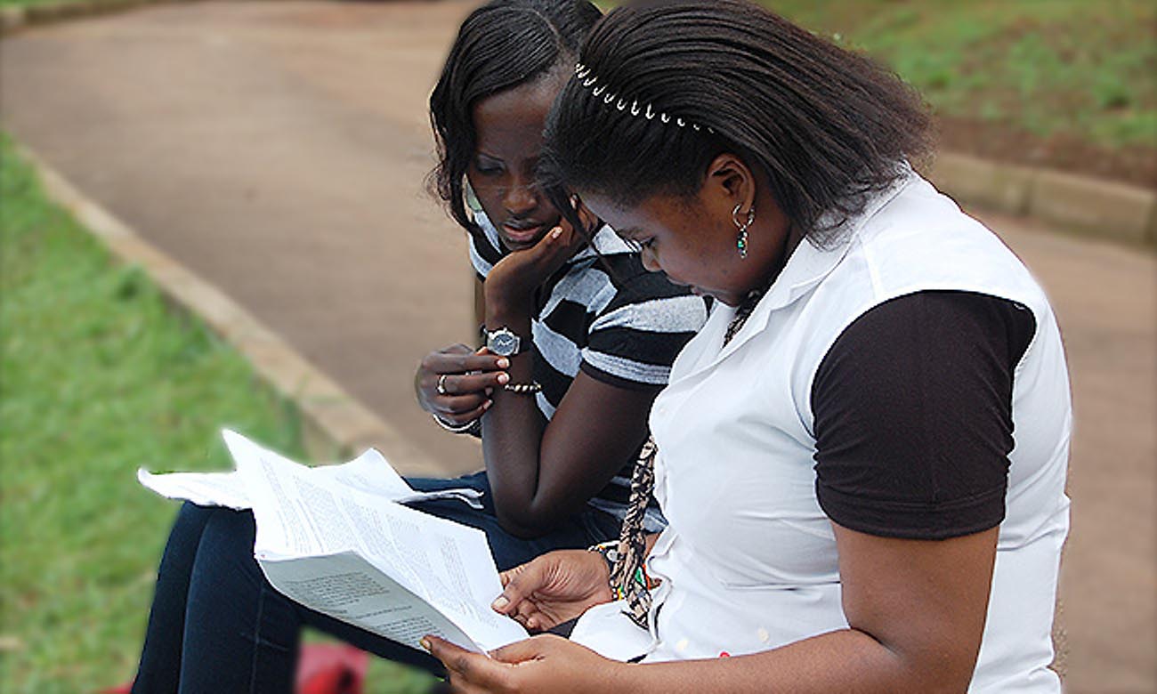 Female students engage in a discussion outdoors at the Makerere University Main Campus. File photo.