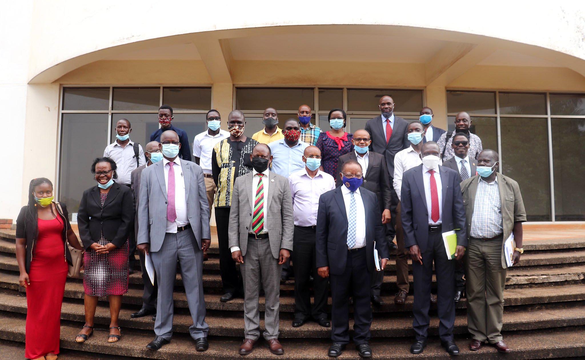 The Chancellor-Prof. Ezra Suruma (3rd R), Vice Chancellor-Prof. Barnabas Nawangwe (C), Chief Guest and NPA Executive Board Member-Prof. Obwoya Kinyera Sam (3rd L) and other participants after the Seminar on "Revisiting Uganda's Rural Development Strategy", 24th November 2020, SFTNB, Makerere University, Kampala Uganda.