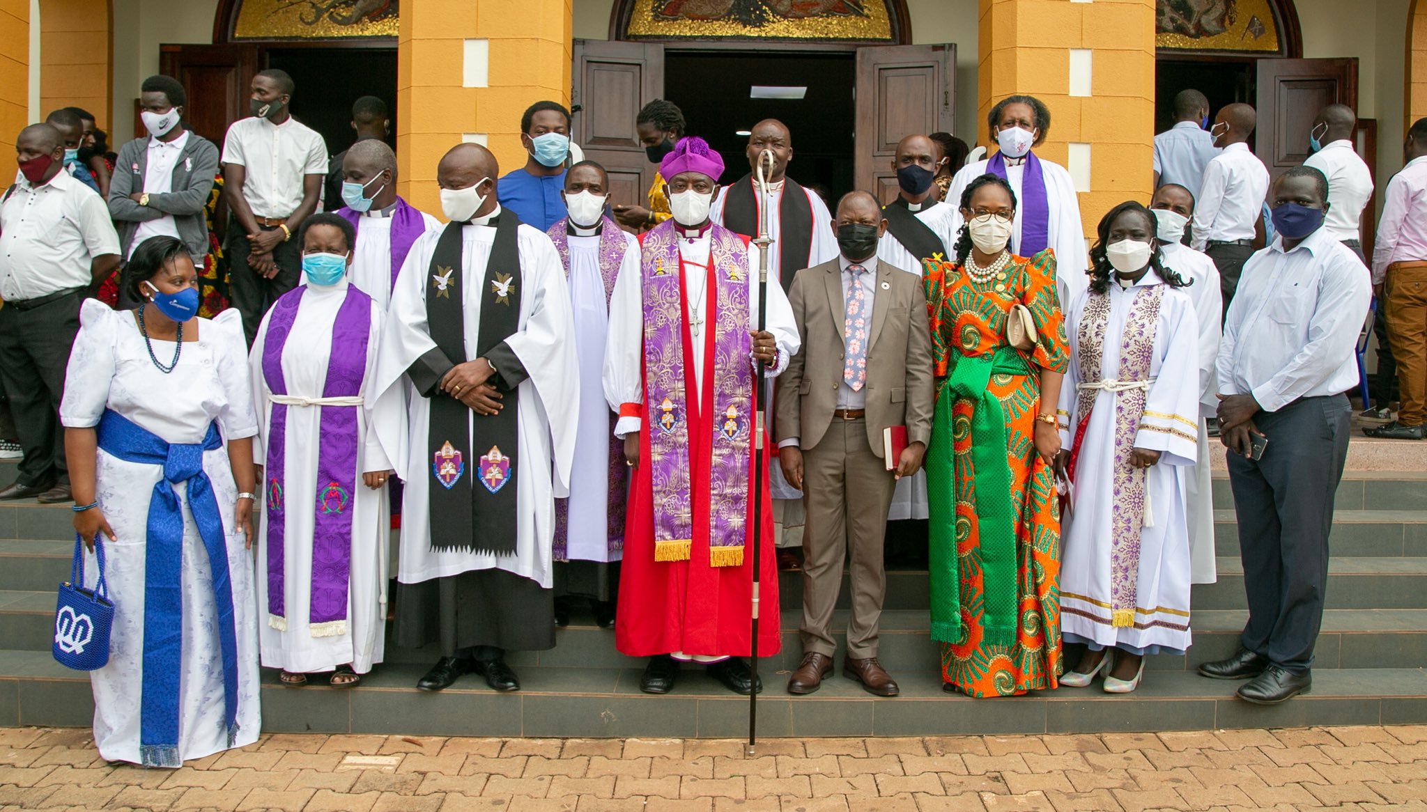 The Archbishop of the Church of Uganda-Rt. Rev. Dr. Stephen Kaziimba Mugalu (4th L) with the Vice Chancellor-Prof. Barnabas Nawangwe and his wife (4th R and 3rd R), St Francis Chaplain-Rev. Can. Onesimus Asiimwe (3rd L) and other members of the clergy and community after mass on 29th November 2020, St. Francis Chapel, Makerere University, Kampala Uganda.