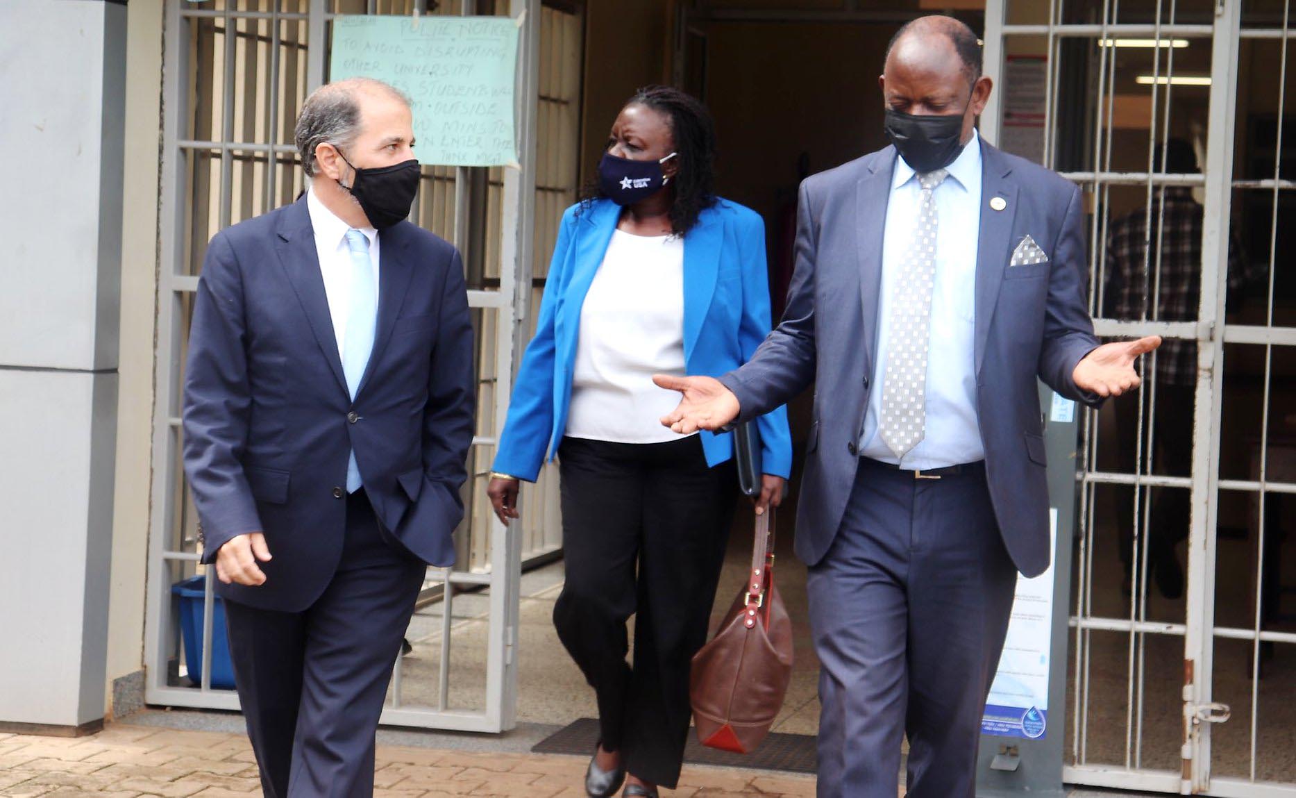 The Vice Chancellor-Prof. Barnabas Nawangwe (R) chats with Brian George (L) and Dorothy Ngalombi (C) after their meeting on 26th November 2020, Central Teaching Facility 1 (CTF1), Makerere University, Kampala Uganda.