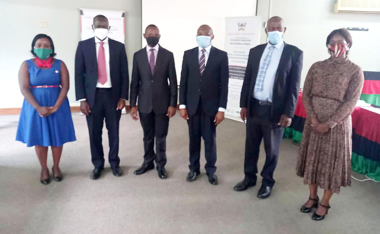 The DVCAA-Dr. Umar Kakumba (3rd L) and Director Quality Assurance-Dr. Vincent Ssembatya (2nd R) pose with PLASHE-WIL Project PI-Dr. Ronald Bisaso (3rd R) and other Team members at the research dissemination on 3rd December 2020, Telepresence Centre, Senate Building, Makerere University.