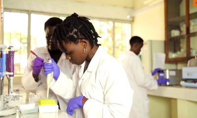 A female student conducts an experiement in one of the Science Labs, Makerere University, Kampala Uganda