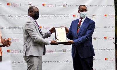 The Vice Chancellor, Prof. Barnabas Nawangwe (L) hands over a plaque to Assoc. Prof. Aaron Mushengyezi, Former member of the MCF Steering Committee and Chairperson, Selection Sub-Committee in recognition of his service on 19th December 2020 at the Makerere University Guest House.