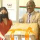 The Vice Chancellor, Prof. Barnabas Nawangwe (R) receives a consignment of face masks from the Director Confucius Institute at Makerere University Xia Zhuoqiong on 18th December 2020 at the Central Teaching Facility 1 (CTF1).