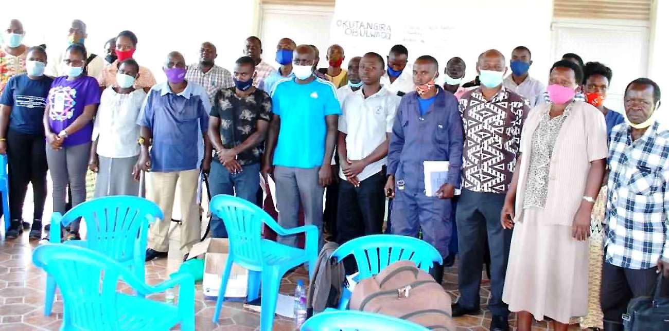 Some of the pig farmers and officials from Wakiso District pose for a group photo with researchers and students from Makerere University during the training on proper Artificial Insemination in pigs, December 2020.