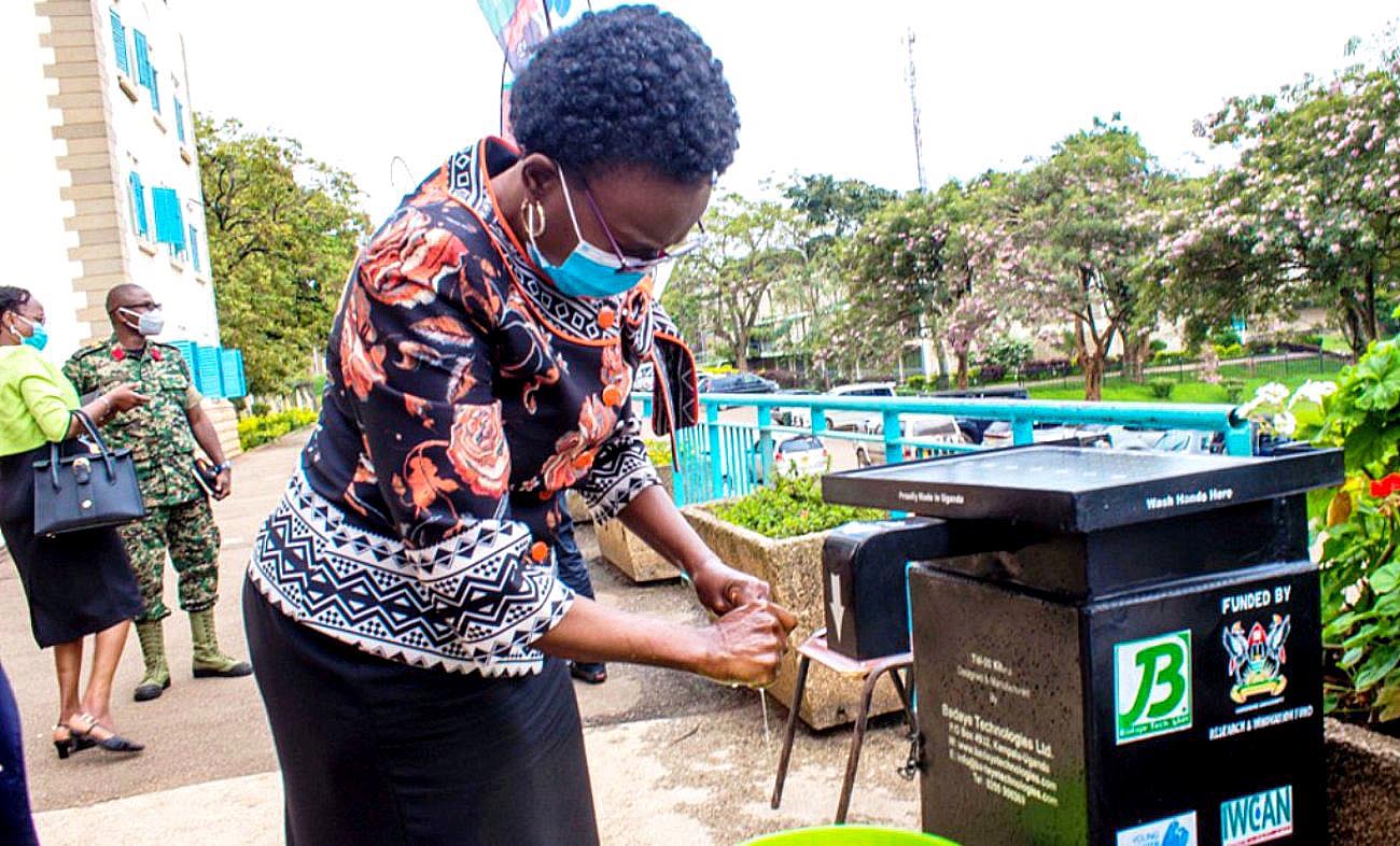 The Minister of Health-Hon. Dr. Jane Ruth Aceng washes her hands after the CCP launch on 16th September 2020 using the Touchless Handwashing Kit (TW-20) developed with support from the Government of Uganda through Mak-RIF