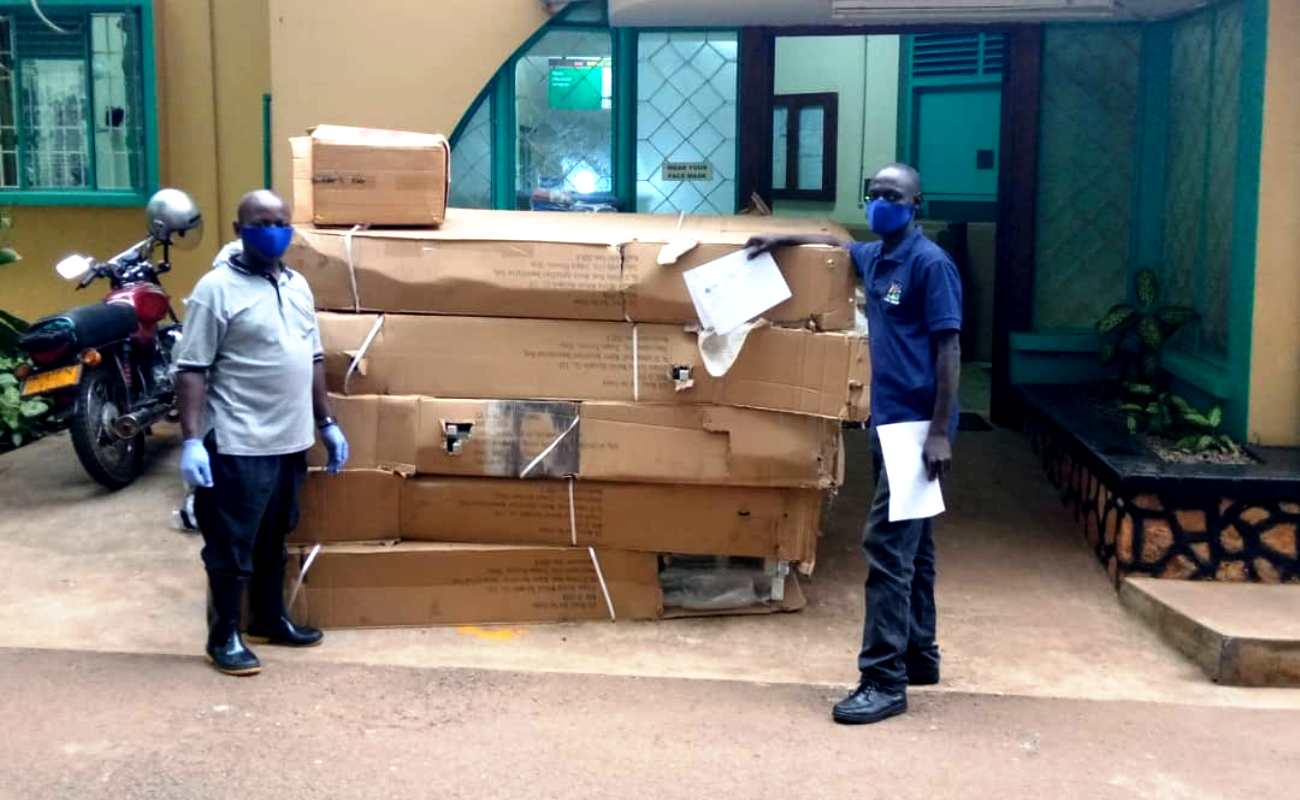 Staff from the Hospital and Joint Medical Store pose with the donation from PSFU on 31st December 2020, Makerere University Hospital, Kampala Uganda.