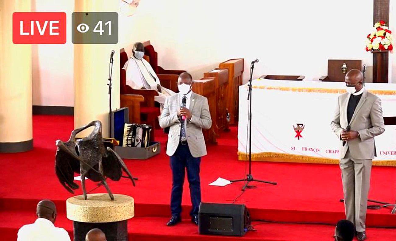 The Vice Chancellor-Prof. Barnabas Nawangwe (L) addresses the congregation as the Chaplain-Rev. Can. Onesimus Asiimwe (R) listens on 3rd January 2021, St. Francis Chapel, Makerere University, Kampala Uganda.