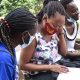 Female Students hold a group discussion at the Main Campus, Makerere University.