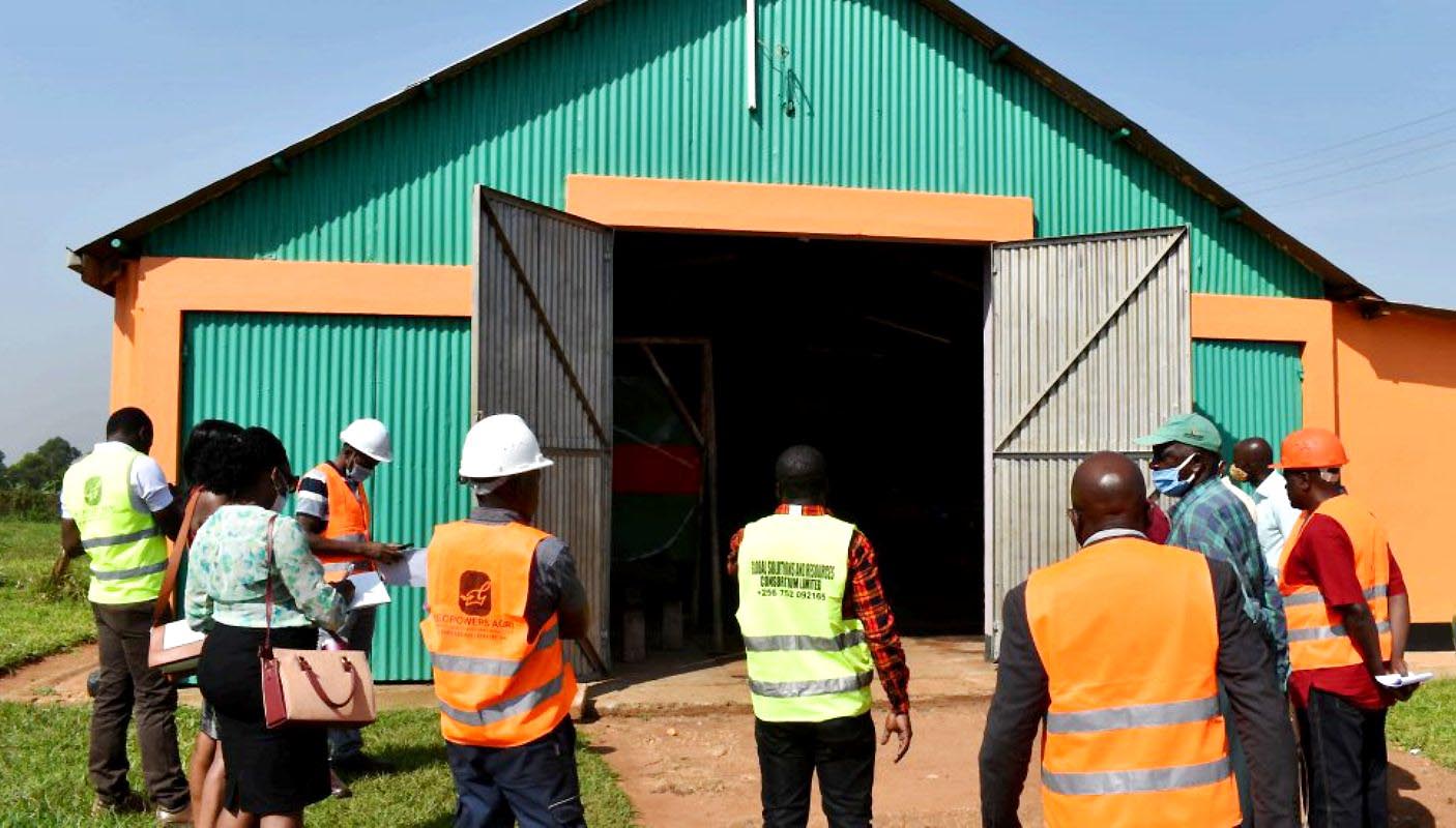 The Inspection Team prepares to make its way into the rehabilitated Agricultural Engineering Workshop Structure on 3rd February 2021, MUARIK, CAES, Makerere University, Wakiso, Uganda. Rehabilitation was undertaken with funding from the Government of Uganda through Mak-RIF.