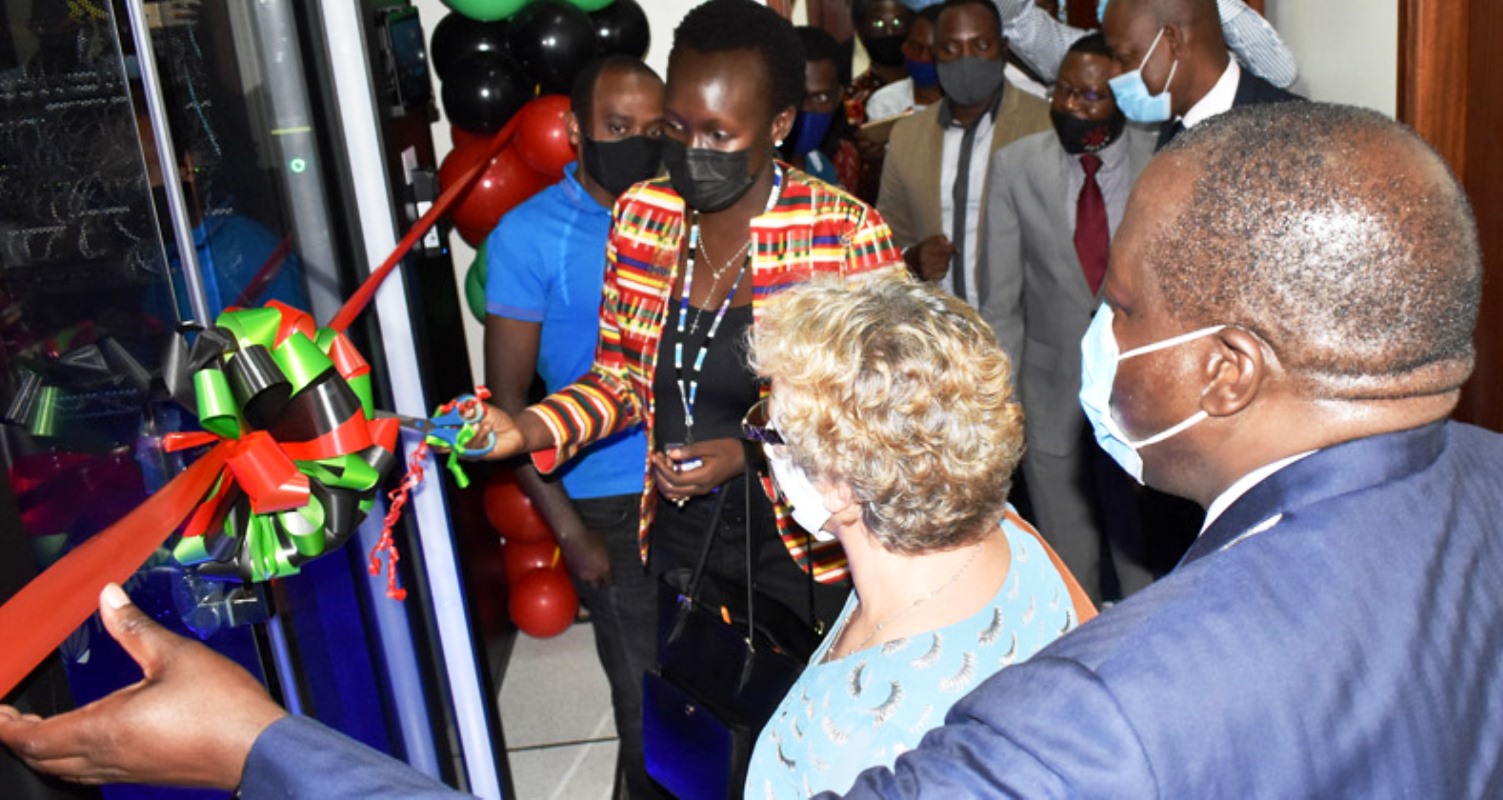 Ag. Executive Director UCC-Eng. Irene Sewankambo cuts the tape to commission the Mak Research Private Cloud Computing Facility on Friday 12th February 2021 at the College of Engineering Design Art and Technology. Second Right is Dr. Gity Behravan while Right is Prof. Tonny Oyana. The facility was established with funding from Sida.