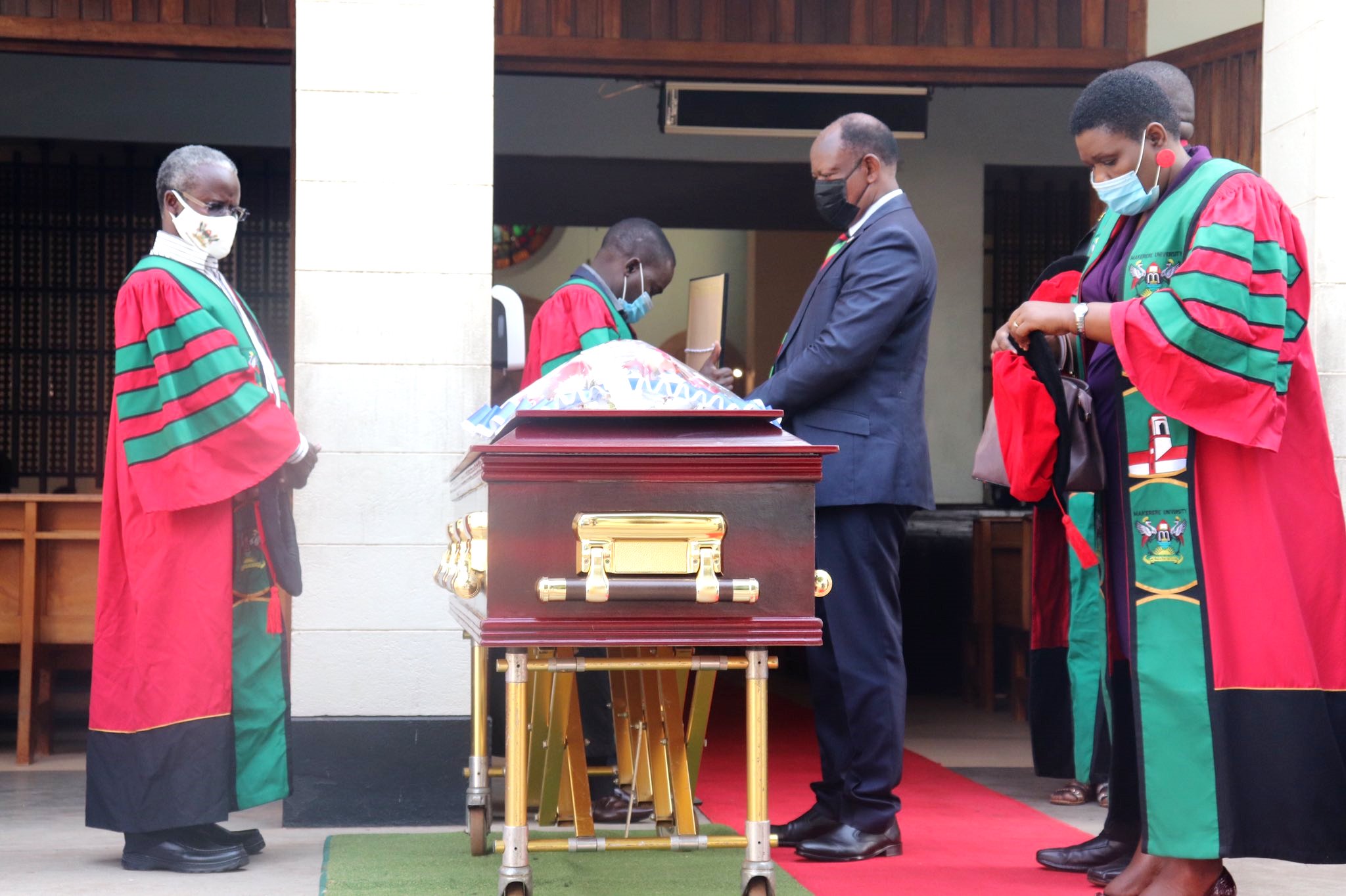 The Vice Chancellor, Prof. Barnabas Nawangwe (2nd R) is joined by Dr. William Tayeebwa (L) and other Academic Staff to pay the last respects to Eng. Prof. Anthony G. Kerali on 23rd February 2021, St. Augustine Chapel, Makerere University.