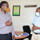 Assoc. Prof. Joseph Ochieng (R) and Dr. John Barugahare (L) chat during the dissemination of study findings on 'Ethical And Social issues for COVID-19 vaccine priority setting and access in Uganda’, 19th March 2021, Anatomy Department, CHS, Makerere University.
