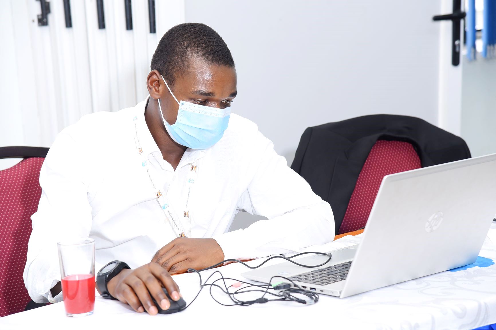 A male participant follows proceedings during the IDI Virtual Science Fair on 25th February 2021