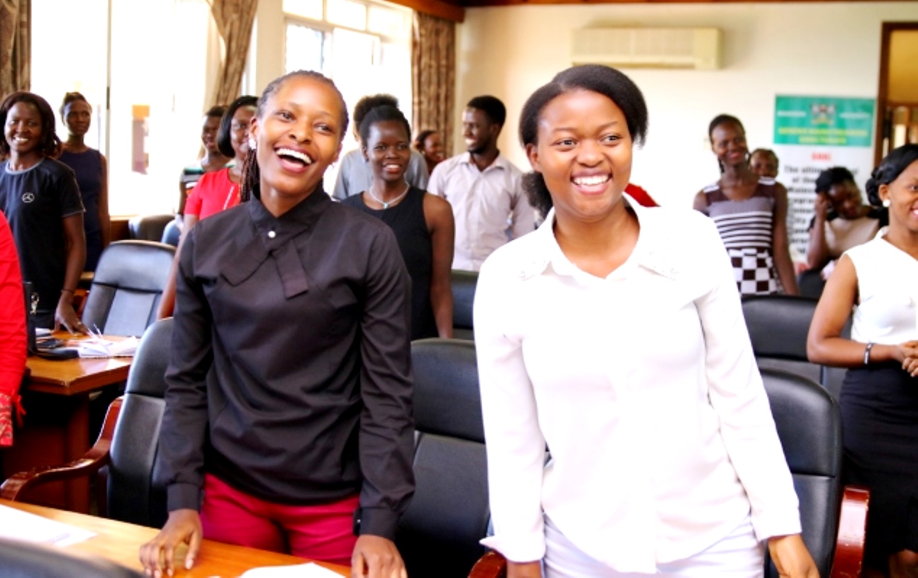 Female Students who attended a presentation on Personal Branding and Career organised by the Gender Mainstreaming Directorate and facilitated by Mr. Daniel Choudry smile during one of the activities on 18th April 2019, Senate Building, Makerere University.