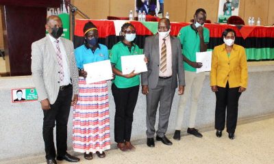 The Vice Chancellor, Prof. Barnabas Nawangwe (L) with MCFSP Coordinator-Dr. Justine Namaalwa (R), MCFSP Selection Committee Chairperson-Dr. Muhammad Ntale (3rd R) and some of the recipients during the Scholarship Award ceremony on 12th March 2021, CTF2 Auditorium, Makerere University.