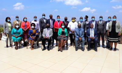 Seated: The Chairperson Council-Mrs. Lorna Magara (3rd R) and Vice Chancellor-Prof. Barnabas Nawangwe (3rd L) with R-L: Dr. Vincent Ssembatya, DVCAA-Dr. Umar Kakumba, Prof. Rhoda Wanyenze and Dr. Josephine Ahikire and other Members of Management (standing) after the Self-Assessment meeting on 12th March 2021, Kampala Skyz Hotel.