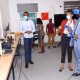 The Vice Chancellor, Prof. Barnabas Nawangwe (R) gets acquainted with Virtual Reality (VR) in the African Center of Excellence in Bioinformatics (ACE), Uganda during the IDI AGM on 15th March 2021, Makerere University, Kampala Uganda, East Africa.