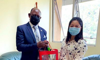 The Vice Chancellor, Prof. Barnabas Nawangwe (L) receives an assortment of Chinese New Year Gifts from Confucius Institute Director, Mrs. Xia Zhuoqiong on 9th February 2021, CTF1, Makerere University.