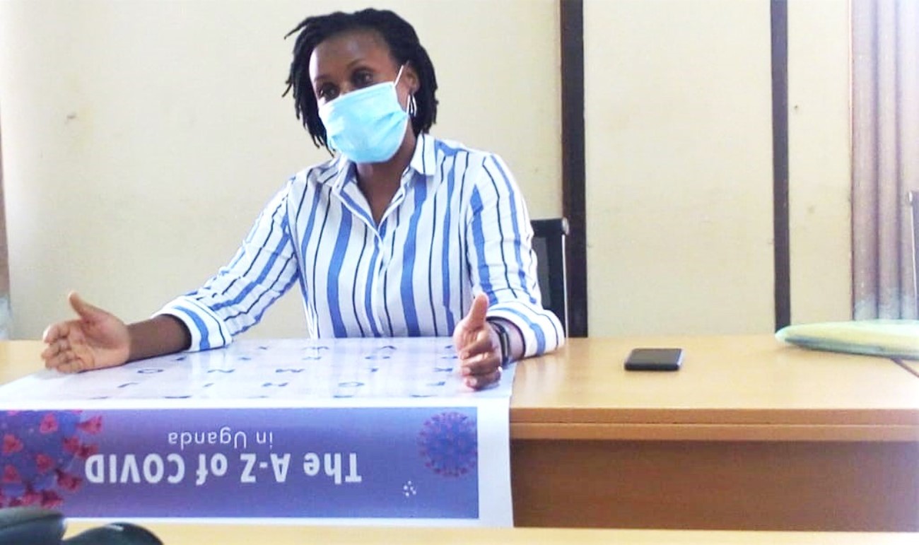 Dr. Gloria Serwagi unveils the COVID Alphabet during a press conference on 17th February 2021, MakSPH, Mulago Campus, Makerere University, Kampala Uganda.