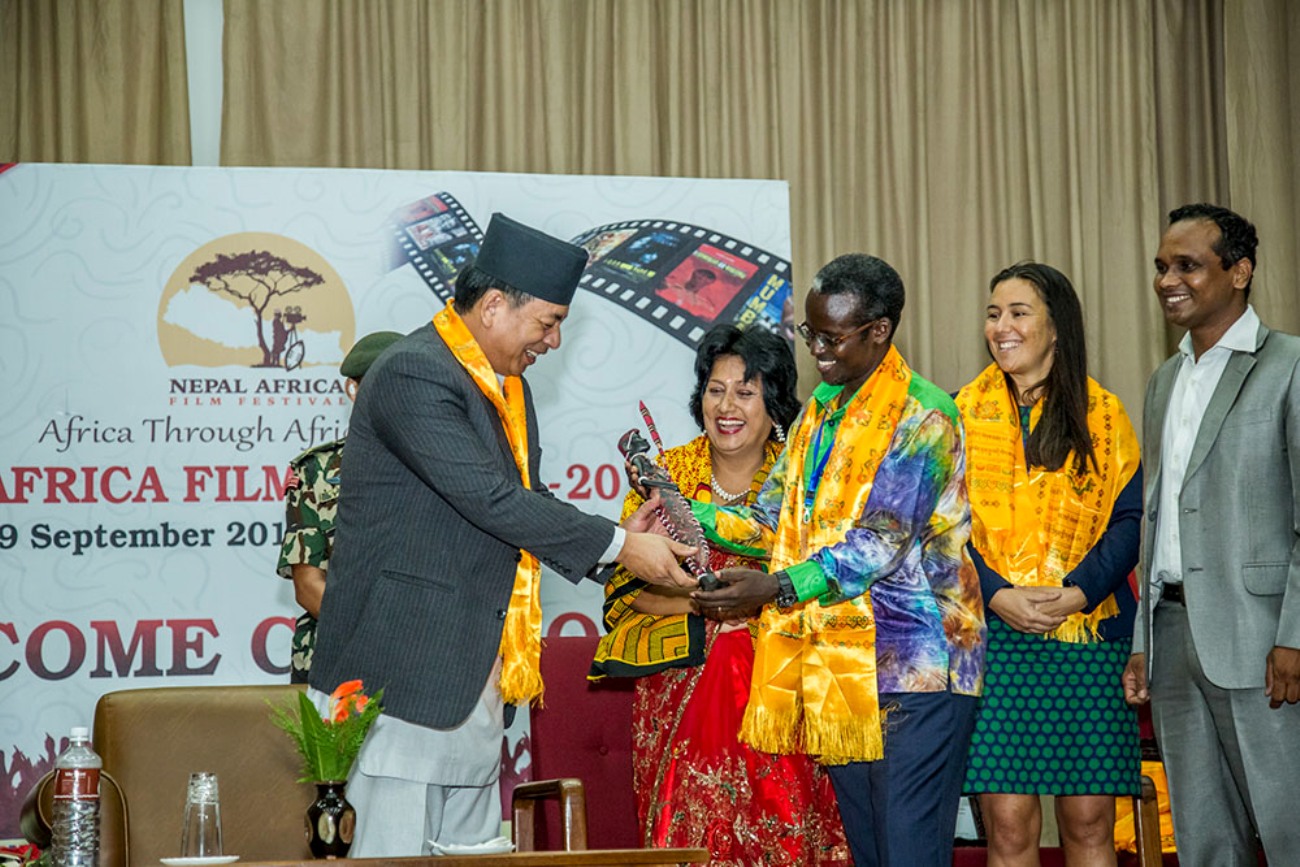 Dr. William Tayeebwa gifting Nepalese Vice President Nanda Bahadur during the 5th Nepal Film Festival as Dr. Manju Mishra of CJMC (2nd L) and Jeanette da Silva look on. Photo credit: New Vision