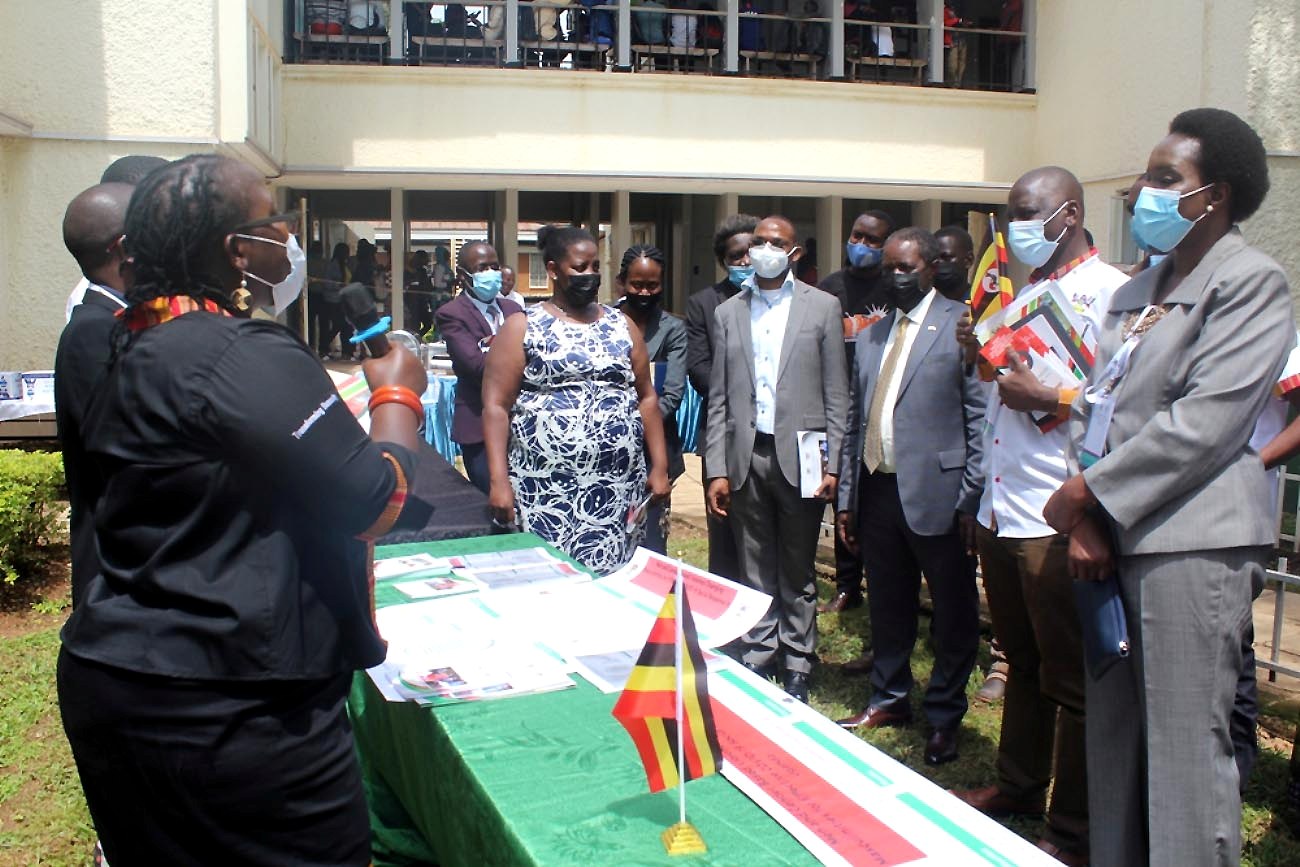 The DVCAA-Dr. Umar Kakumba (4th R), Chairperson Mak-RIF GMC-Prof. William Bazeyo (3rd R), Deputy Principal CHUSS-Dr. Julius Kikooma (2nd R) together with the Mak-RIF Secretariat and PIs listen to the Principal CHUSS-Dr. Josephine Ahikire (L) during a tour of exhibitions at the Arts Quadrangle, CHUSS on 29th April 2021.