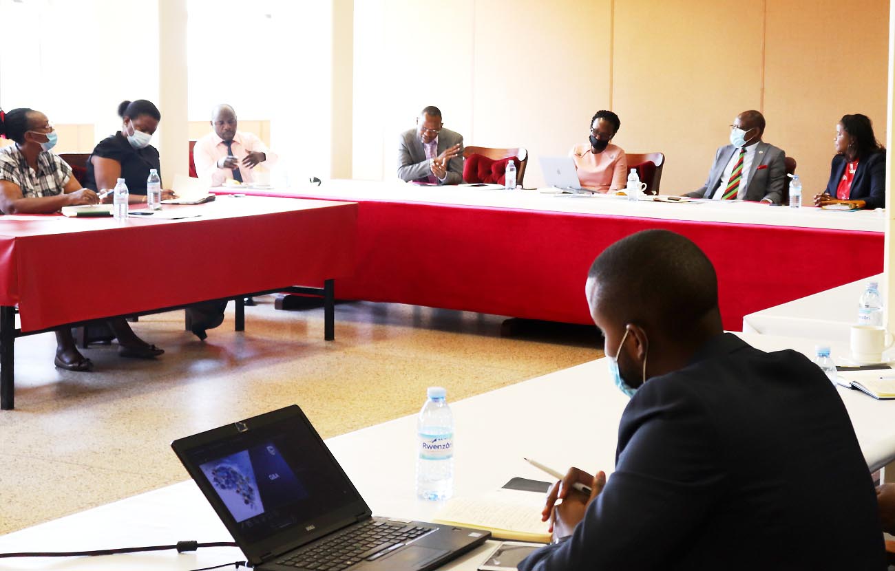 The Vice Chancellor-Prof. Barnabas Nawangwe (2nd R), Stanbic Bank CEO-Ms. Anne Juuko (R), Ag. DVCFA, Dr. Josephine Nabukenya (3rd R) and other members of Central Management listen to DVCAA-Dr. Umar Kakumba (4th L) during the meeting on 12th April 2021, CTF1, Makerere University.