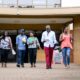 Users stroll out of the Main Library, Makerere University in the pre-COVID era.