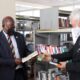 The Japanese Ambassador to Uganda, H.E. Fukuzawa Hidemoto (R) and the Vice Chancellor, Prof. Barnabas Nawangwe (L) admire some of the titles after the donation was handed over on 20th April 2021, Main Library, Makerere University