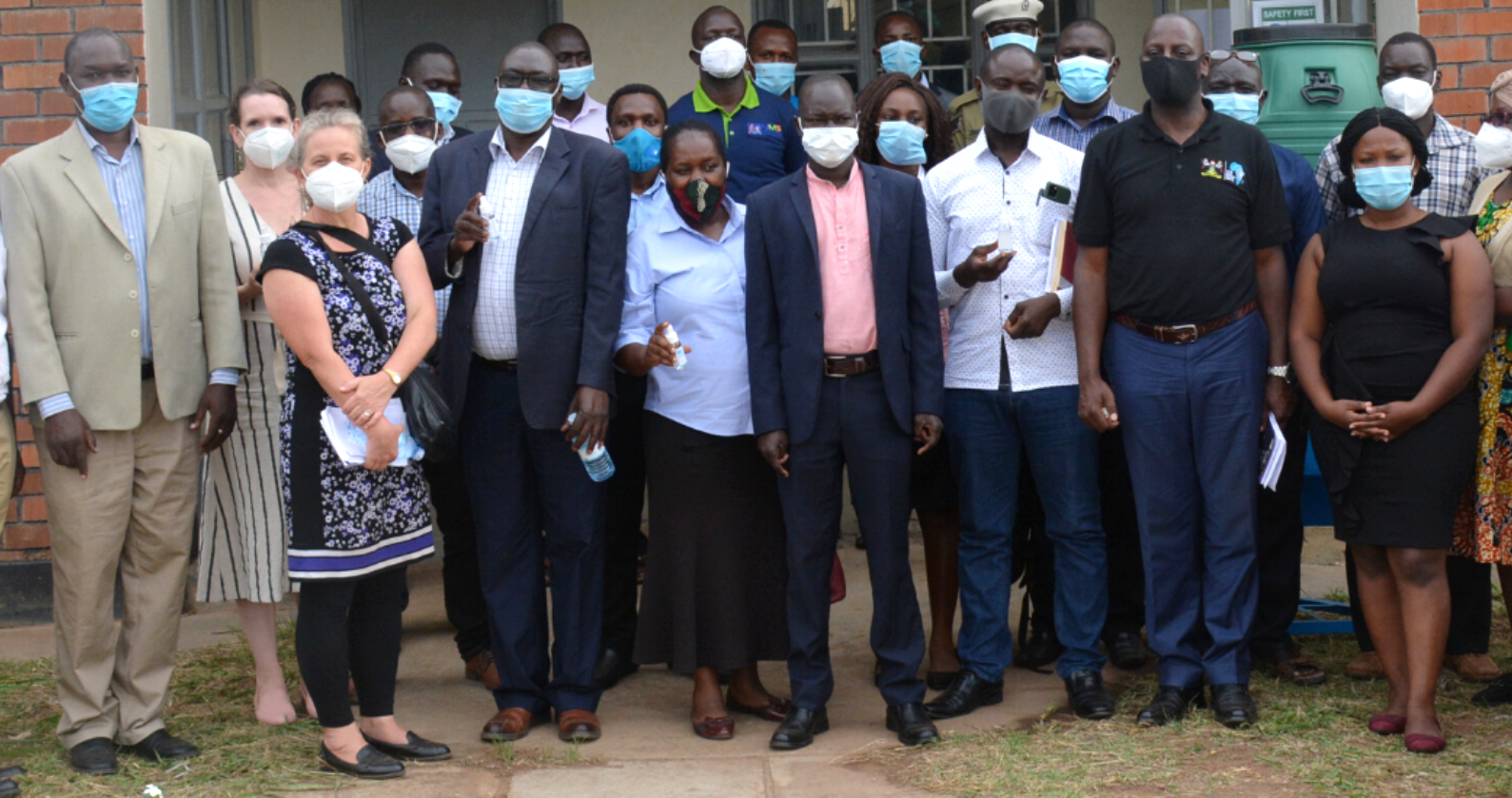 CDC Uganda Country Director-Dr. Lisa Nelson (2nd L), Executive Director IDI-Dr. Andrew Kambugu (2nd R), Amuru RDC-Mr. Augustine Modo (4th R), Amuru DHO-Dr. Odong Patrick Olwedo (L) and other officials during the IDI/CDC Alcohol-Based Hand Rub Project Official Launch in May 2021, Amuru District.