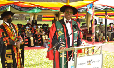 Dr. Akinwumi A. Adesina, President of the African Development Bank Group (R) flanked by the Vice Chancellor, Prof. Barnabas Nawangwe (L) delivers his acceptance speech after receiving the Honorary Doctor of Letters (Honoris Causa) during Day 5 of the 71st Graduation held on 21st May 2021 in the Freedom Square, Makerere University.