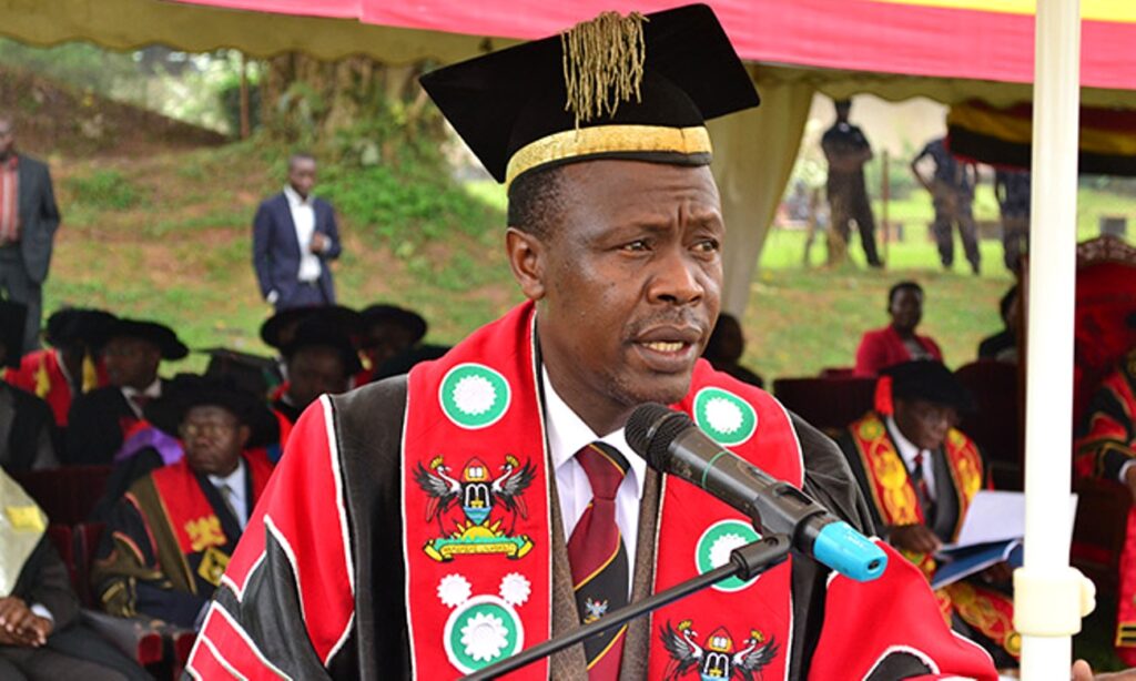 The Academic Registrar, Mr. Alfred Namoah Masikye addresses the congregation during a graduation ceremony in the Freedom Square, Makerere University.