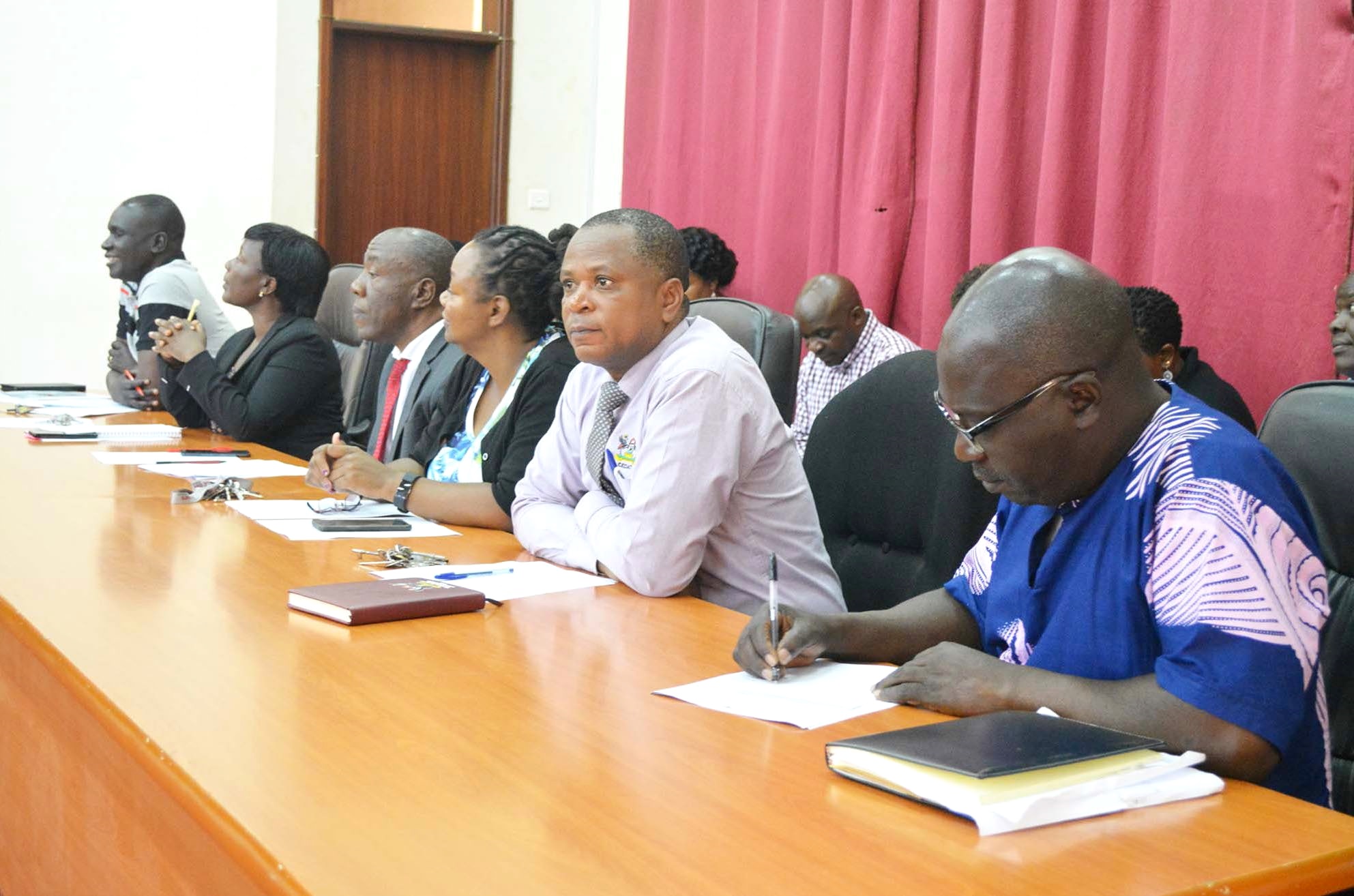 The Principal-Prof. Henry Alinaitwe (3rd L), Deputy Principal-Dr. Venny Nakazibwe (2nd L), with Deans R-L: Dr. Kizito Maria Kasule, Dr. Moses Musinguzi, Dr. Dorothy Kabagaju Okello and Heads of Department at a meeting in the CEDAT Conference Hall, Makerere University.