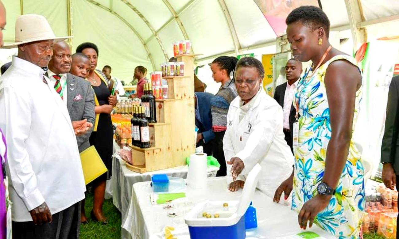 H.E. President Yoweri Kaguta Museveni (Left) and the Vice Chancellor-Prof. Barnabas Nawangwe (2nd Left) listen to Prof. Margret Kahwa (2nd Right) talk about the Anti-Tick vaccine that kills all types of ticks during the Agricultural Day and Exhibition, 25th September 2019, Makerere University, Kampala Uganda.